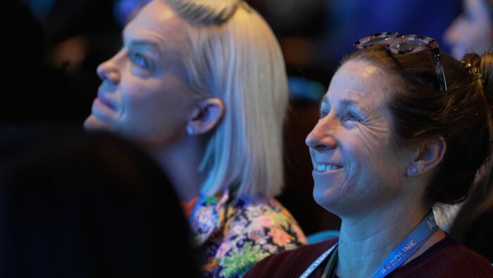 Chad E Foster engaging laughing audience during keynote at Boston AONL conference