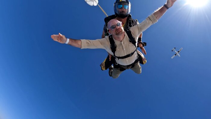 Chad E Foster in freefall during Dubai skydive, showing fearless approach to life